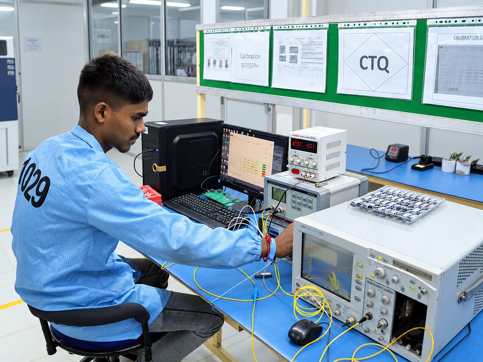 A Syrotech technician calibrating optical modules at a CTQ test station